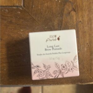 100% Pure Brow Pomade in brown, new sealed container